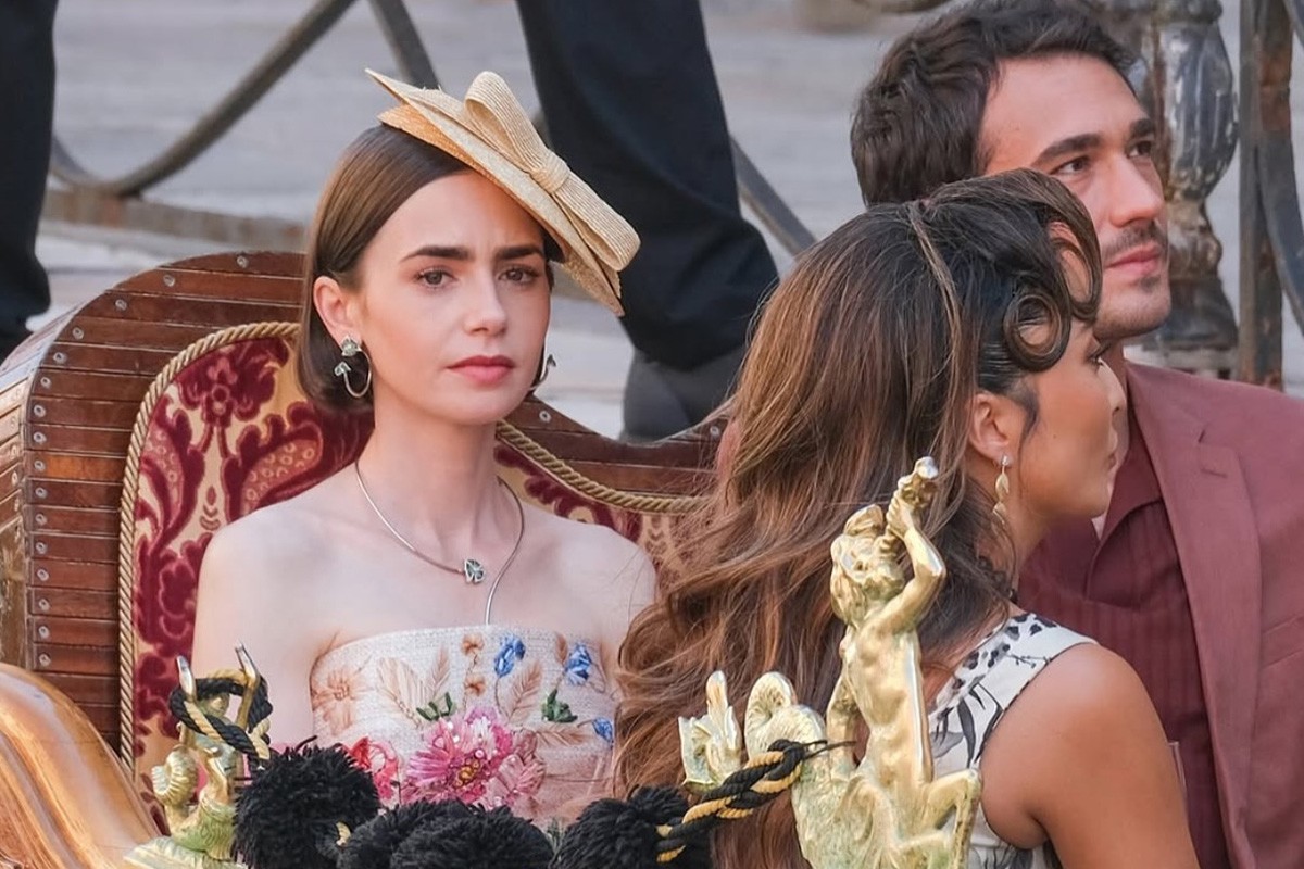 Emily's floral embroidered dress and green jewels on Emily In Paris