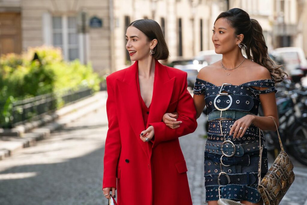 Emily's red suit + Mindy's denim buckle dress on Emily In Paris
