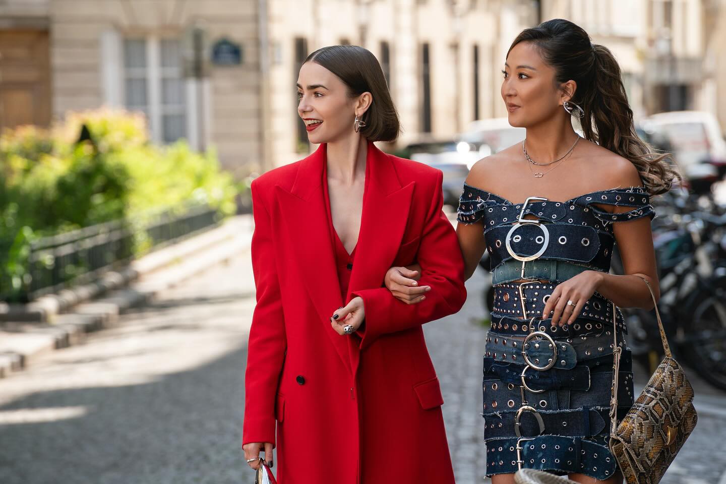 Emily's red suit + Mindy's denim buckle dress on Emily In Paris